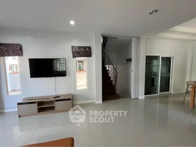 Spacious modern living room with sleek design and natural light