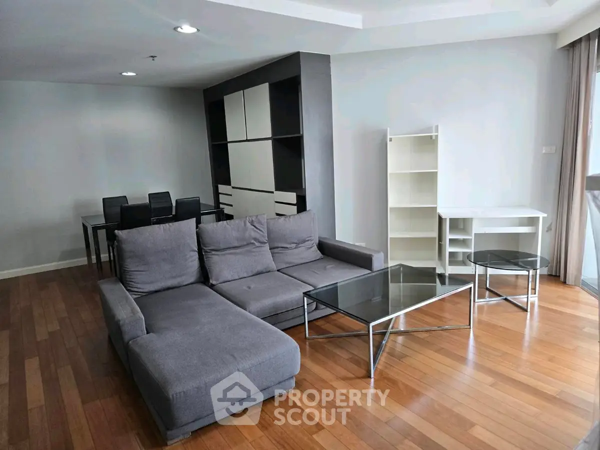 Spacious modern living room with sleek furniture and wooden flooring