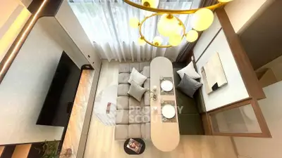 Modern living room with stylish decor and elegant lighting