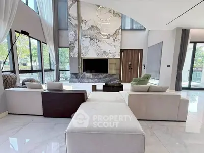 Luxurious modern living room with high ceilings and elegant decor