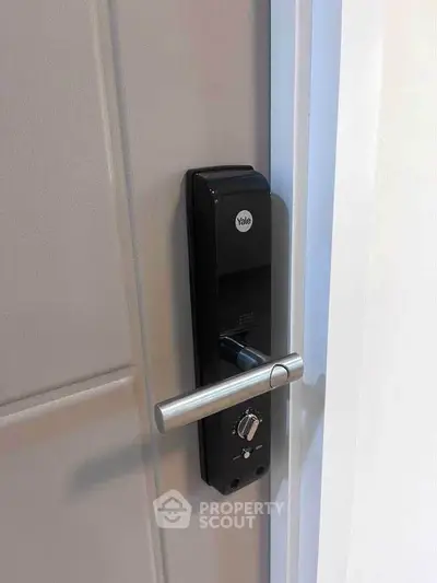Modern digital door lock on sleek interior door, enhancing security and style in contemporary homes.