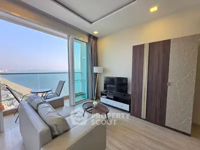 Modern living room with stunning ocean view and balcony access