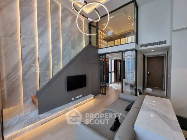 Luxurious modern living room with elegant staircase and stylish lighting