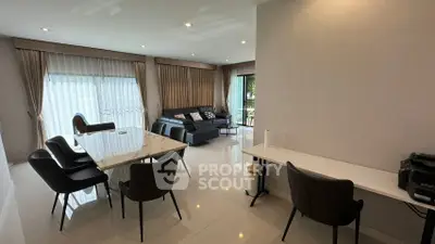 Spacious modern living room with elegant dining area and natural light