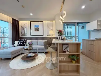 Modern living room with open kitchen, stylish decor, and balcony view in a high-rise apartment.