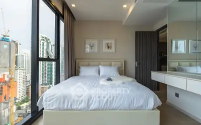 Luxurious bedroom with stunning city view in modern high-rise apartment