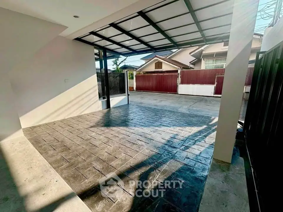 Spacious covered parking area with modern design in residential property