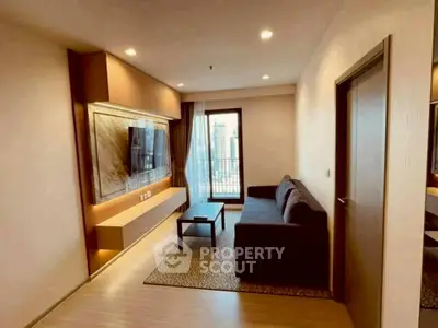 Modern living room with sleek furniture and city view balcony.