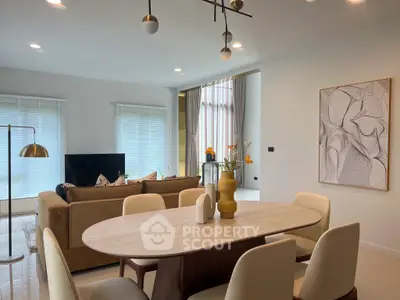 Modern living room with stylish dining area and elegant decor