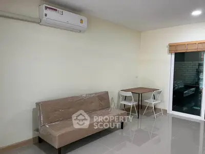 Modern living room with air conditioning and minimalist furniture