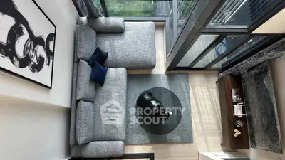 Modern living room with large windows and stylish decor