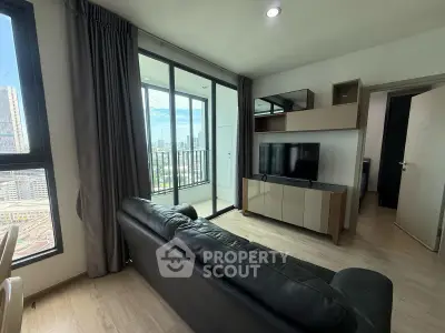 Modern living room with balcony view in high-rise apartment
