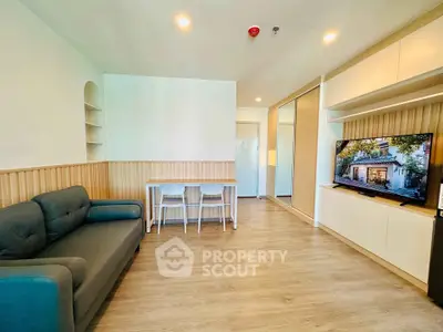 Modern living room with sleek furniture and built-in storage, perfect for cozy gatherings.