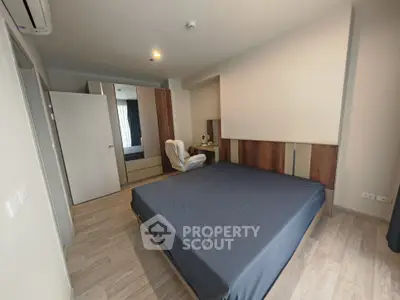 Spacious modern bedroom with sleek design and ample natural light