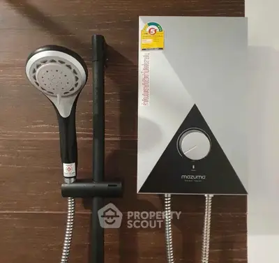 Modern bathroom shower and water heater setup with sleek design.
