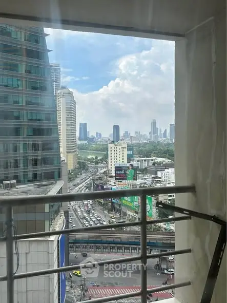 Stunning urban view from high-rise balcony with cityscape and skyline