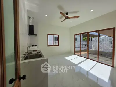 Spacious kitchen with open layout and large windows for natural light