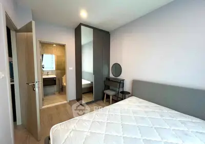 Modern bedroom with ensuite bathroom and stylish furniture