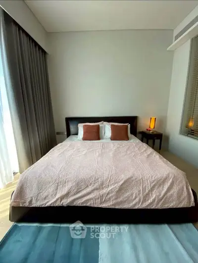 Modern bedroom with stylish decor and natural light
