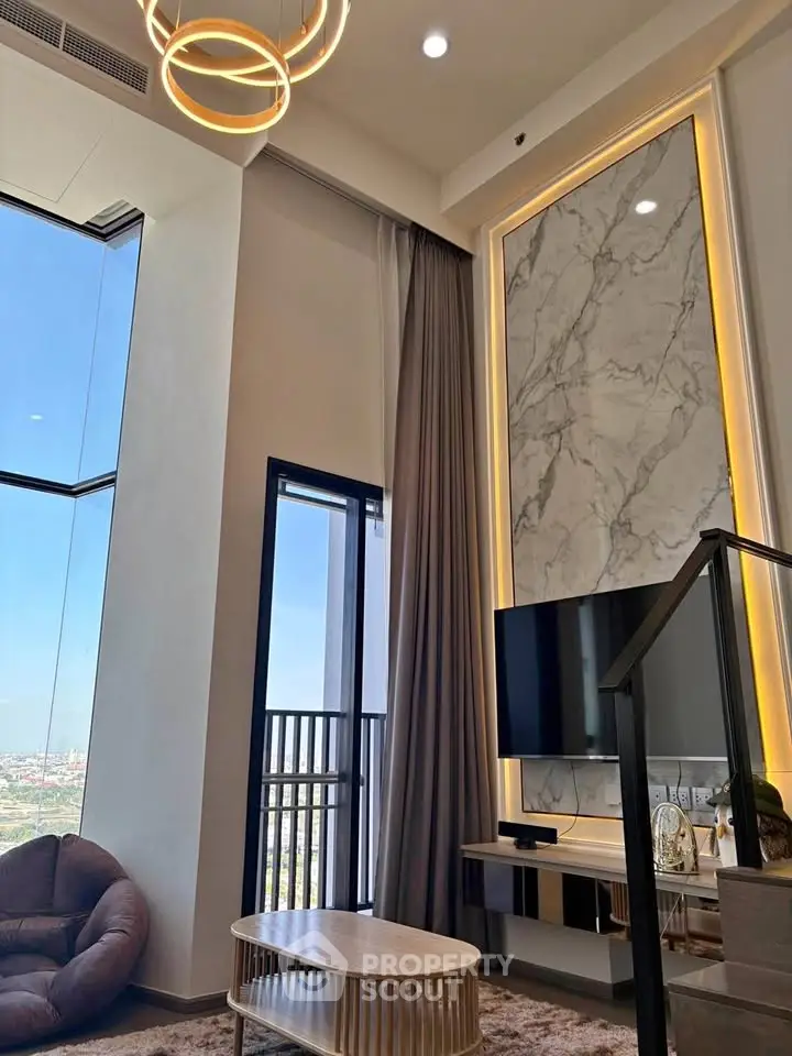 Luxurious high-ceiling living room with modern decor and stunning city view
