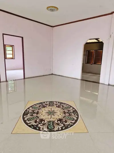Spacious room with elegant tile design and natural light