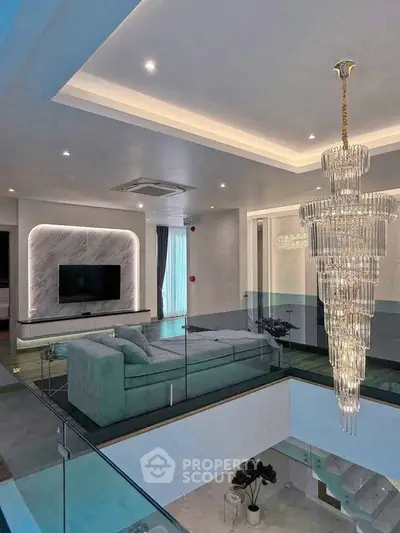Luxurious modern living room with elegant chandelier and stylish decor