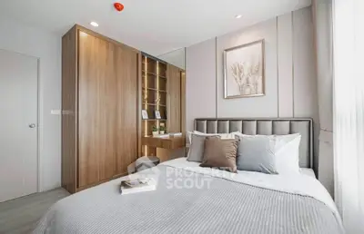 Modern bedroom with stylish decor and built-in wardrobe, perfect for a cozy and elegant living space.