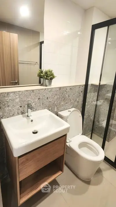 Modern bathroom with sleek design and glass shower enclosure