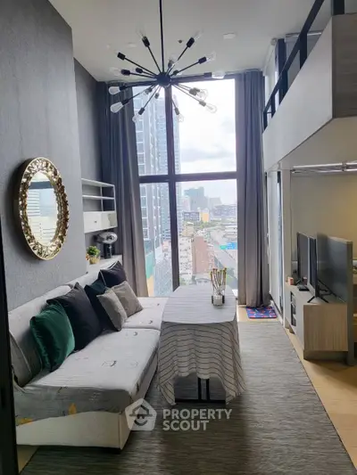 Stylish modern living room with high ceiling and city view, featuring chic decor and loft space.