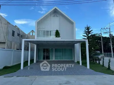 Modern minimalist house with spacious carport and sleek design, perfect for contemporary living.
