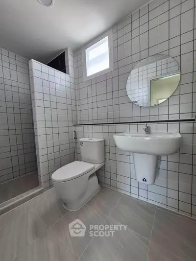 Modern bathroom with sleek tiles and minimalist fixtures