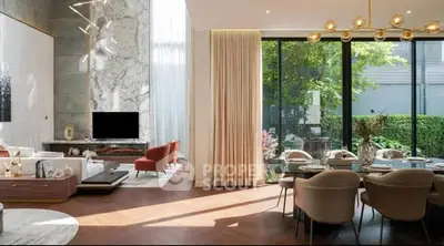 Luxurious modern living room with high ceilings, elegant decor, and large windows overlooking a lush garden.