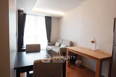 Modern living room with cozy seating and natural light