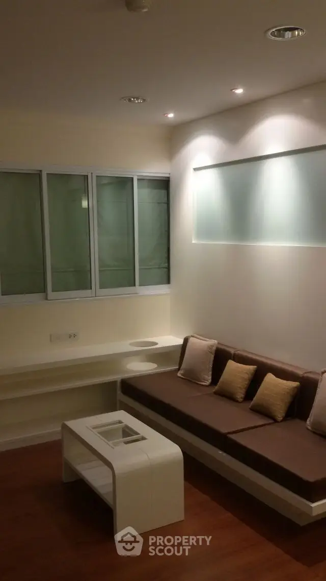 Modern living room with sleek built-in seating and ambient lighting