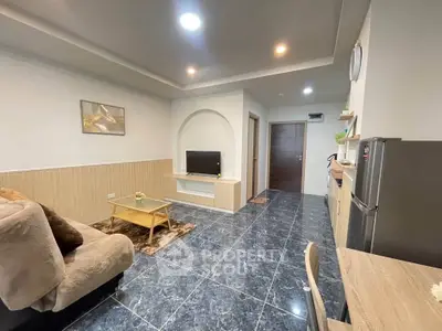 Modern living room with sleek design and open kitchen layout