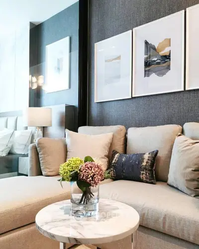 Luxurious living room with elegant decor and modern art on walls