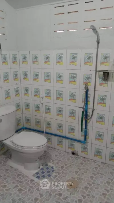 Charming bathroom with unique tile design and modern shower fixtures.