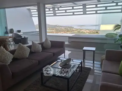 Luxurious living room with stunning ocean view and modern decor