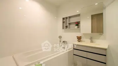 Modern bathroom with sleek design and built-in bathtub