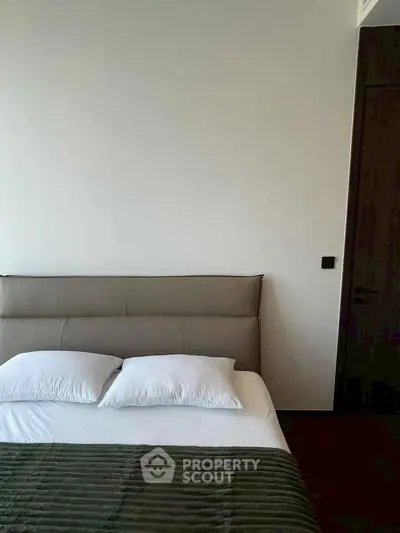 Modern bedroom with minimalist design and cozy bedding