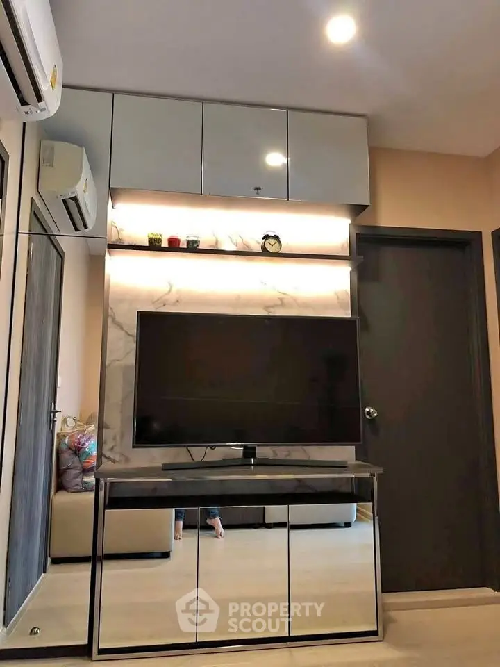 Modern living room with sleek TV unit and stylish decor