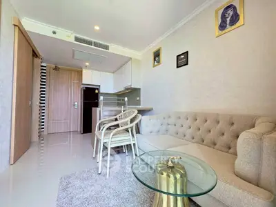 Modern living room with elegant sofa and glass coffee table in stylish apartment.