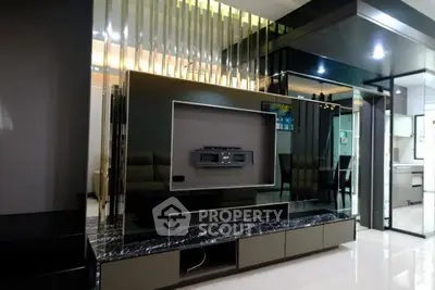 Luxurious modern living room with sleek TV unit and marble accents