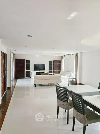 Spacious living room with modern furniture and natural light