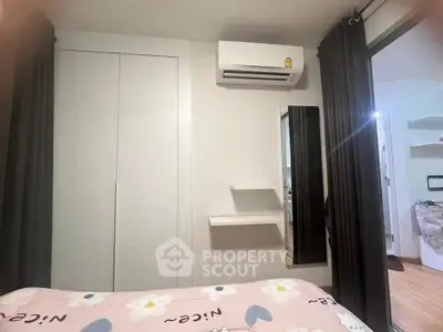 Cozy bedroom with air conditioning and modern decor in a stylish apartment.