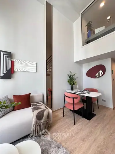 Modern duplex living room with stylish decor and cozy dining area