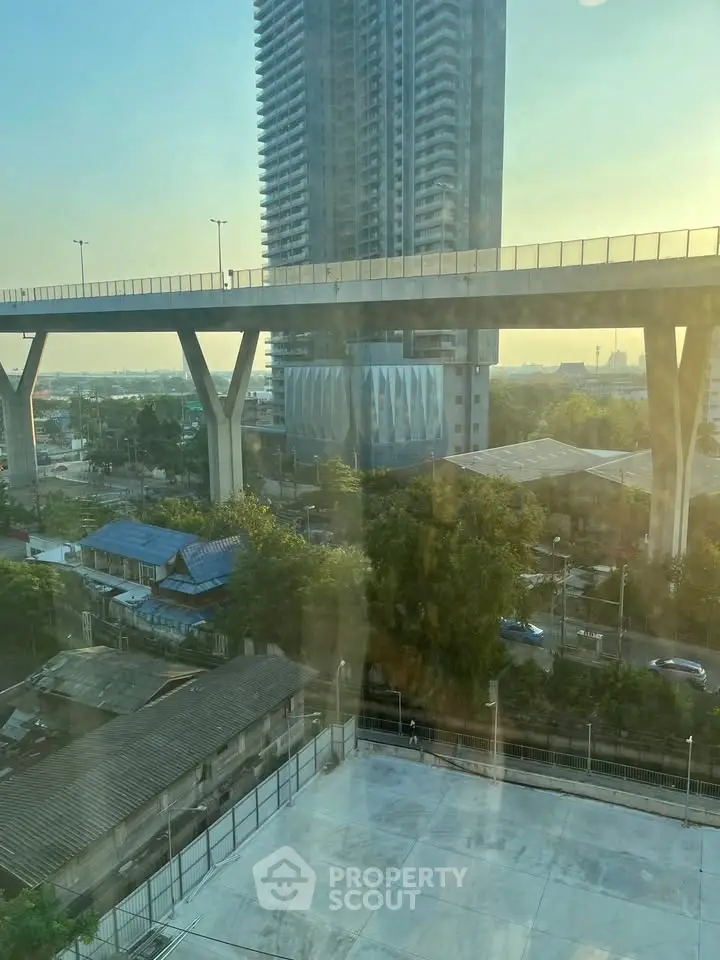 Stunning urban view from high-rise building with modern architecture and expansive cityscape.