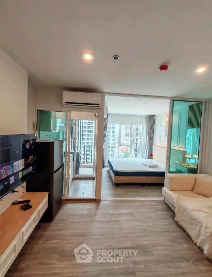 Modern open-plan living room with balcony view in a stylish apartment