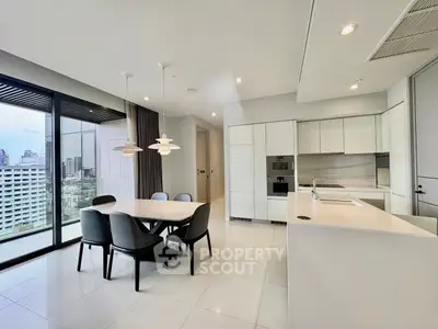 Modern kitchen and dining area with city view and sleek design