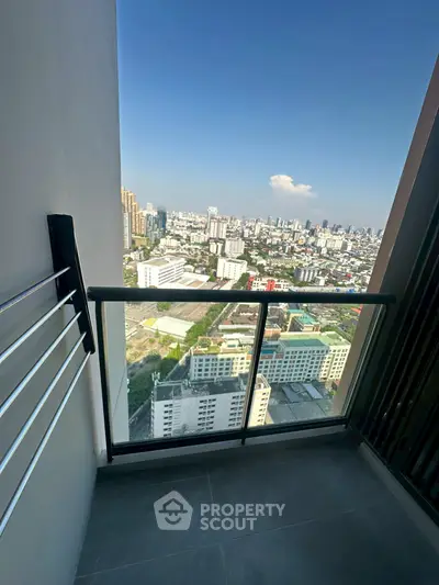 Stunning high-rise balcony with panoramic city view, perfect for urban living enthusiasts.